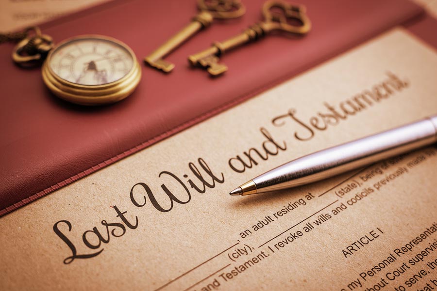 Last Will & Testament paper with pen, watch, and keys